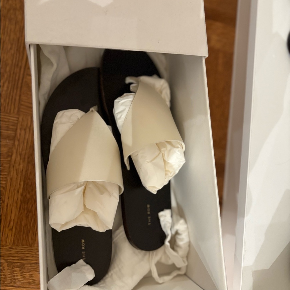 The Row Avery Thong Sandals in Milk